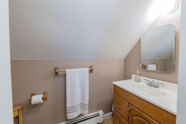 bathroom featuring vaulted ceiling and vanity