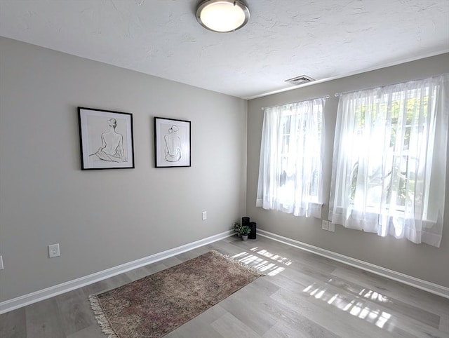 3202 Halcyon Dr Unit 3202, Worcester, MA 01606 - empty room featuring wood finished floors and a textured ceiling