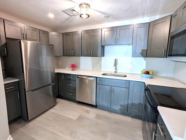 3202 Halcyon Dr Unit 3202, Worcester, MA 01606 - kitchen featuring appliances with stainless steel finishes, light wood-style floors, and light countertops