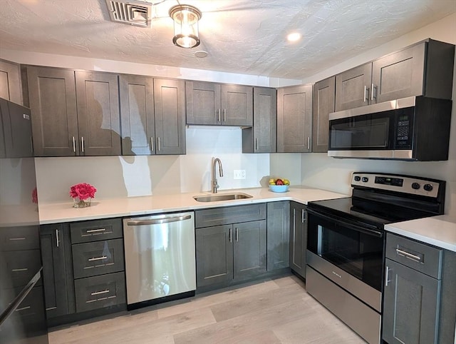 3202 Halcyon Dr Unit 3202, Worcester, MA 01606 - kitchen with appliances with stainless steel finishes, light wood finished floors, and light countertops