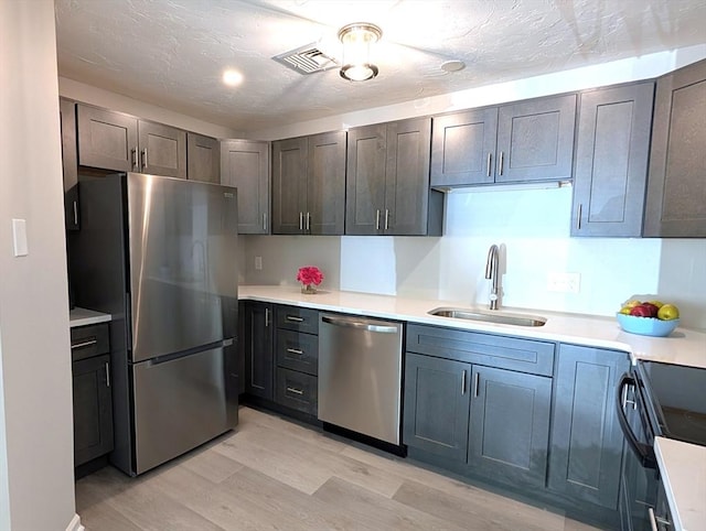 3202 Halcyon Dr Unit 3202, Worcester, MA 01606 - kitchen with appliances with stainless steel finishes, light wood-style floors, and light countertops