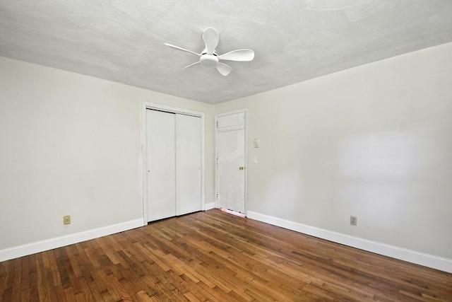 175 Armsby Rd, Sutton, MA 01590 - unfurnished bedroom featuring baseboards, wood finished floors, a ceiling fan, and a closet