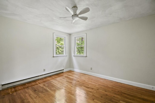 175 Armsby Rd, Sutton, MA 01590 - empty room with a baseboard heating unit, light wood finished floors, baseboards, and ceiling fan