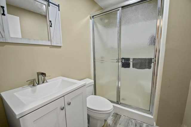 175 Armsby Rd, Sutton, MA 01590 - bathroom featuring toilet, a stall shower, vanity, and wood finished floors
