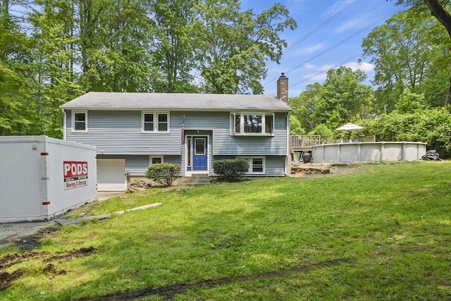 175 Armsby Rd, Sutton, MA 01590 - bi-level home with a chimney, a front lawn, an outdoor pool, and an attached garage