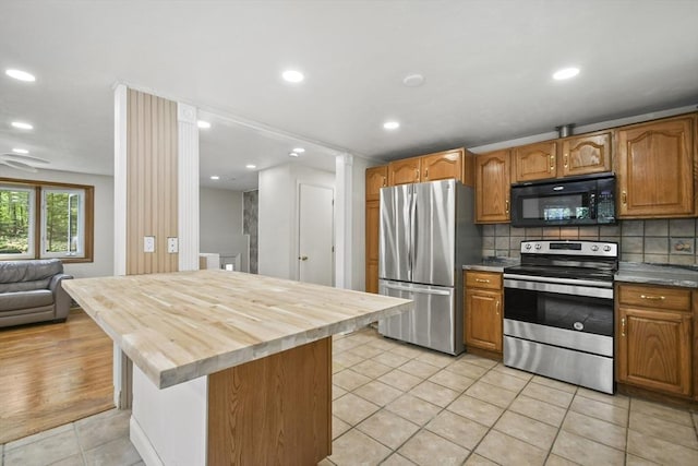 175 Armsby Rd, Sutton, MA 01590 - kitchen with stainless steel appliances, light tile patterned floors, wood counters, backsplash, and recessed lighting