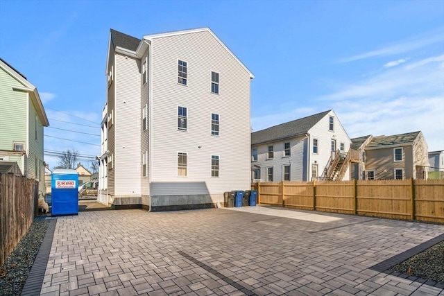 rear view of property featuring a patio