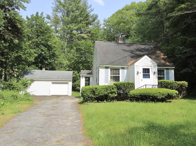 554 Wachusett St, Holden, MA 01520 - view of front of house with an outbuilding, driveway, a chimney, and roof with shingles
