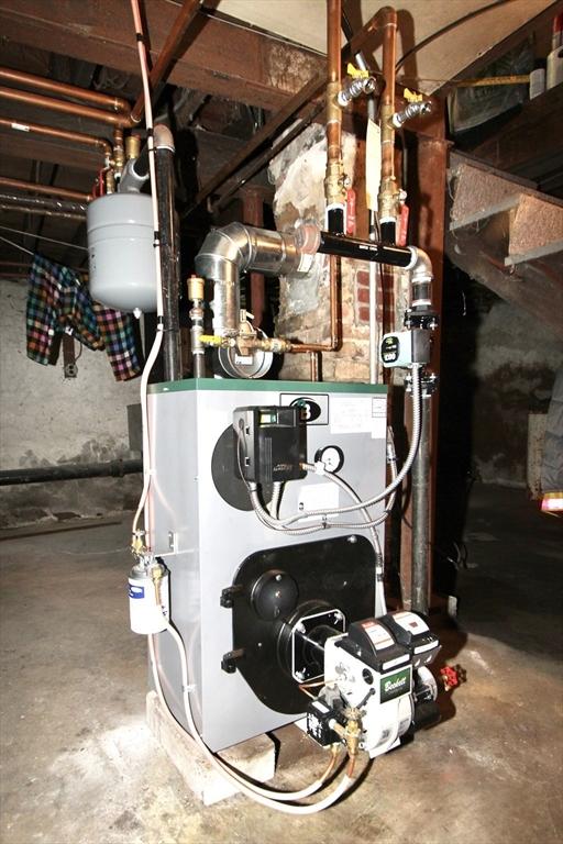 554 Wachusett St, Holden, MA 01520 - utility room with a heating unit