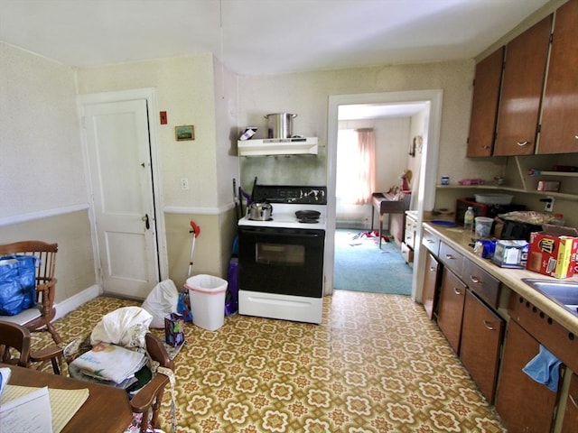 554 Wachusett St, Holden, MA 01520 - kitchen with electric stove, under cabinet range hood, light countertops, and brown cabinets