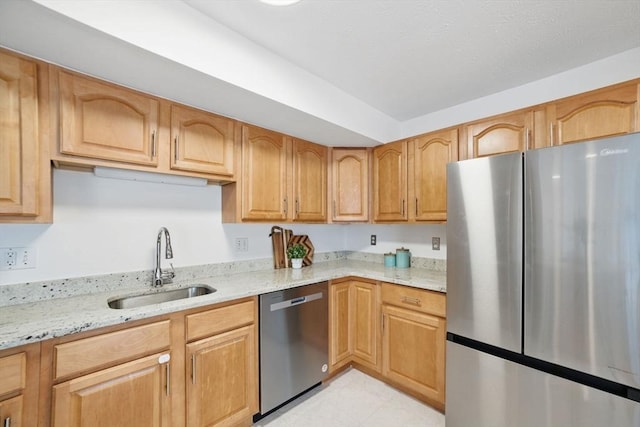 7 Conant Rd Unit 23, Winchester, MA 01890 - kitchen featuring stainless steel appliances, a sink, light stone countertops, and light tile patterned flooring