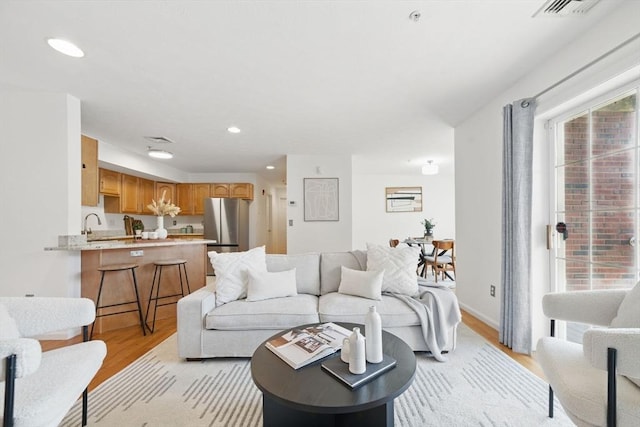 7 Conant Rd Unit 23, Winchester, MA 01890 - living area featuring light wood-style floors and recessed lighting