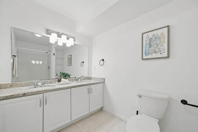7 Conant Rd Unit 23, Winchester, MA 01890 - full bath with double vanity, a shower stall, tile patterned floors, toilet, and baseboards