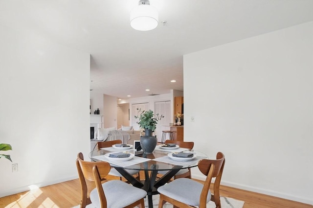 7 Conant Rd Unit 23, Winchester, MA 01890 - dining room featuring light wood-style flooring, a fireplace, baseboards, and recessed lighting
