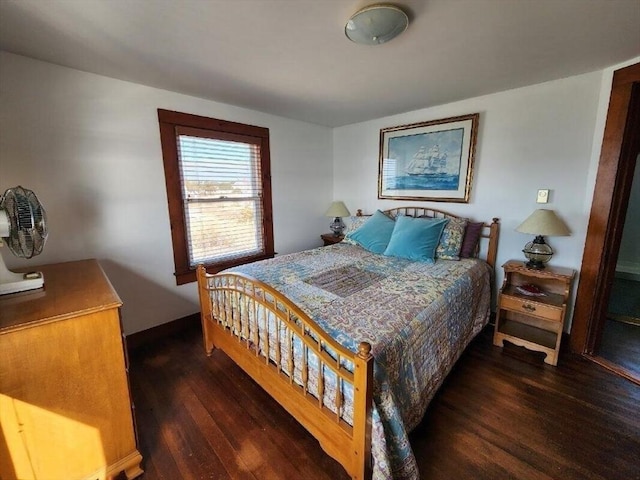 bedroom featuring dark hardwood / wood-style flooring