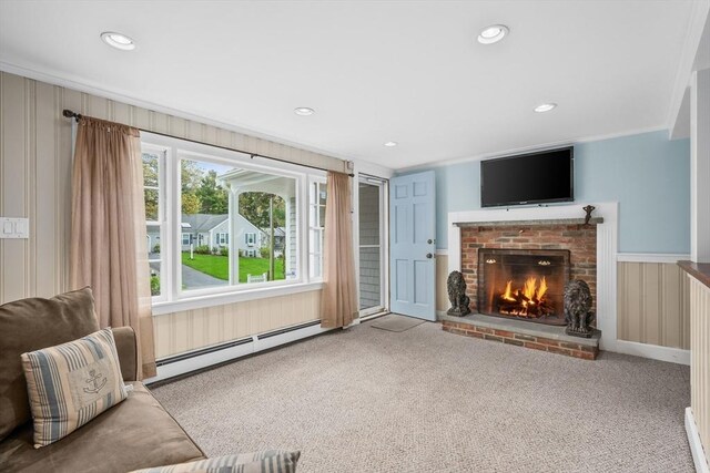 unfurnished living room with a baseboard heating unit, a fireplace, carpet flooring, recessed lighting, and ornamental molding
