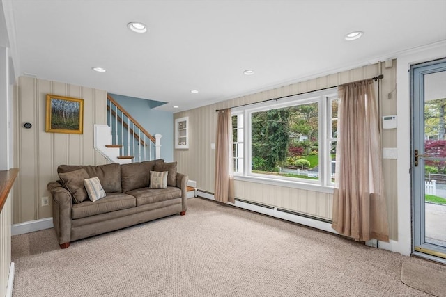 carpeted living room with stairs, recessed lighting, baseboards, and a baseboard heating unit