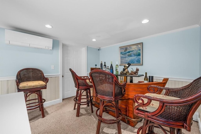 indoor dry bar with a wall mounted air conditioner, carpet floors, a wainscoted wall, recessed lighting, and crown molding