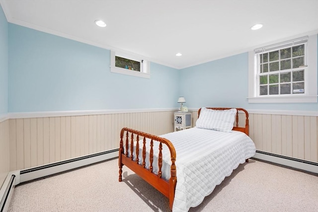 bedroom featuring a wainscoted wall, crown molding, multiple windows, a baseboard radiator, and recessed lighting