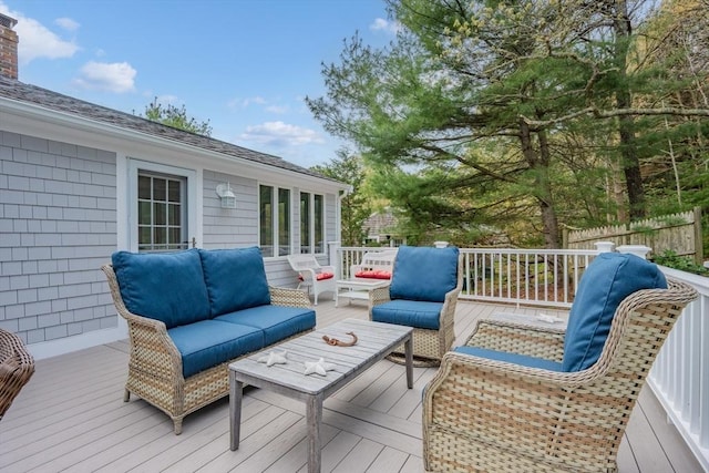 wooden deck with an outdoor living space