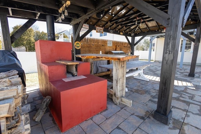 view of patio featuring a gazebo and fence