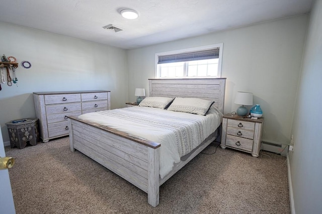 bedroom featuring visible vents, baseboards, a baseboard heating unit, and carpet