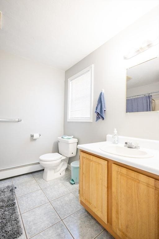 full bathroom featuring tile patterned floors, toilet, vanity, and a baseboard radiator