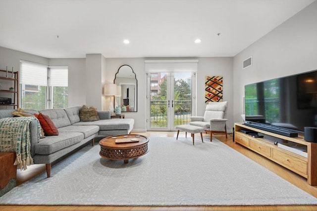 16 Miner St Unit 307, Boston, MA 02215 - living area with plenty of natural light, recessed lighting, wood finished floors, and baseboards