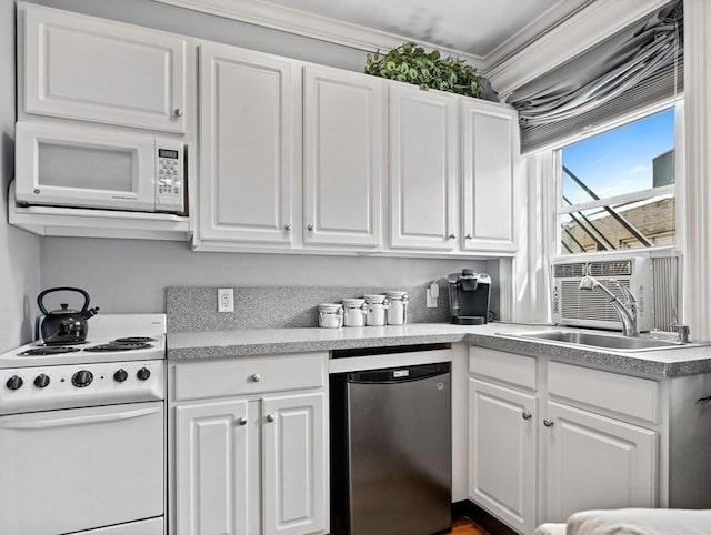 kitchen featuring white appliances, white cabinetry, and crown molding