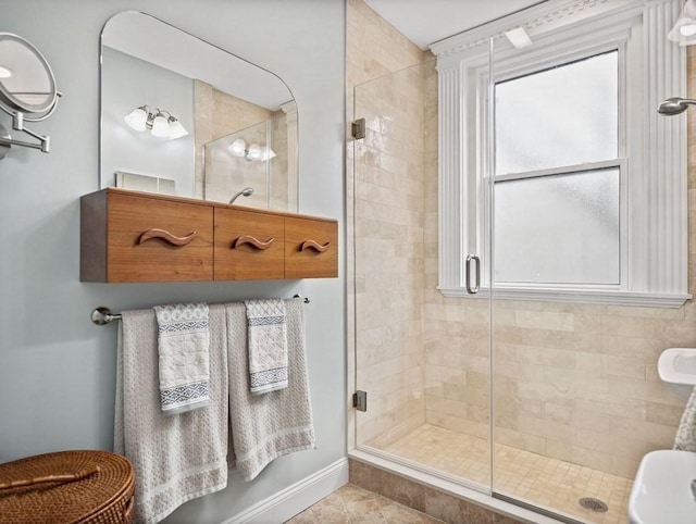 bathroom with tile patterned flooring and an enclosed shower