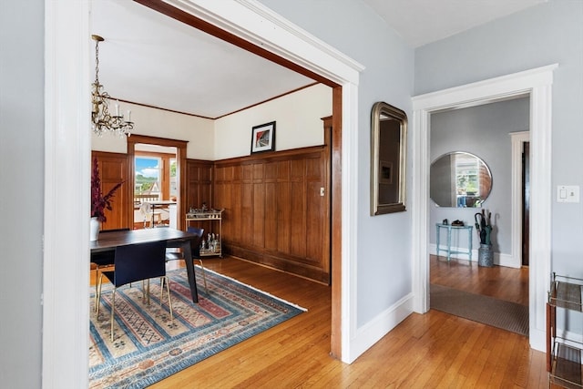 office space featuring wood-type flooring and a notable chandelier