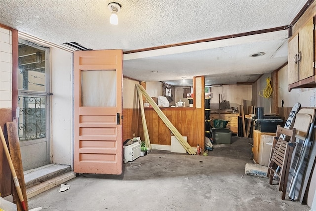 basement featuring a textured ceiling