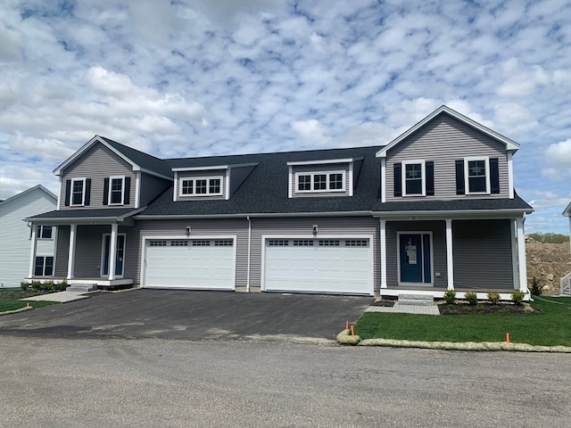 view of front of home with a porch and a garage