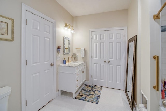 full bath featuring toilet and vanity