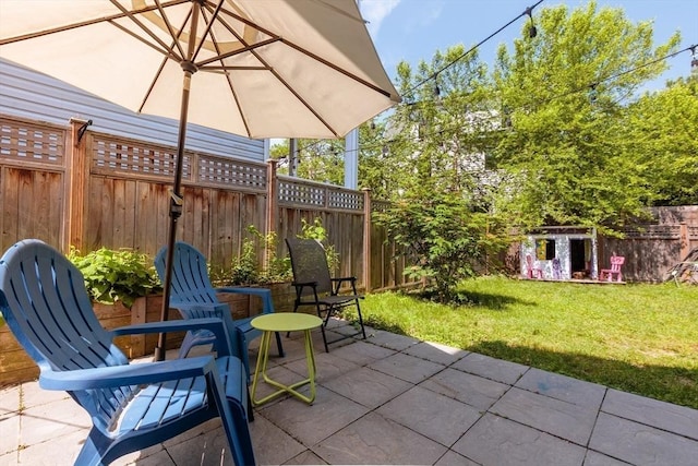 13 Sargent Ave Unit 1, Somerville, MA 02145 - fenced backyard featuring a patio area and a shed