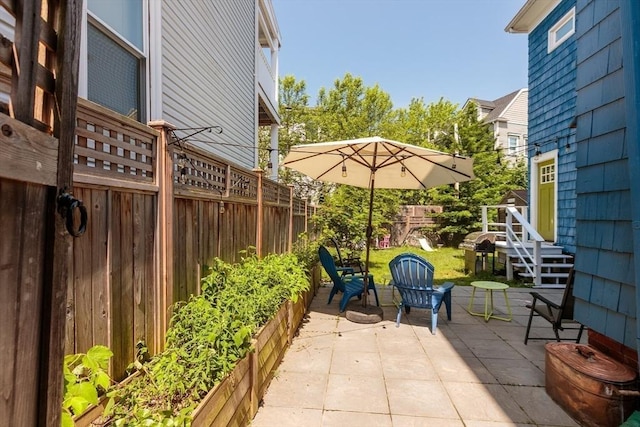 13 Sargent Ave Unit 1, Somerville, MA 02145 - fenced backyard with a patio and area for grilling