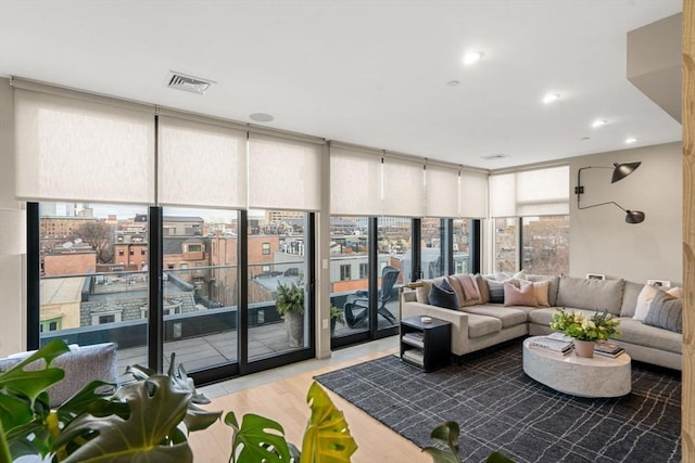 7 E Springfield Unit Ph6, Boston, MA 02118 - living room featuring expansive windows and light wood-style flooring