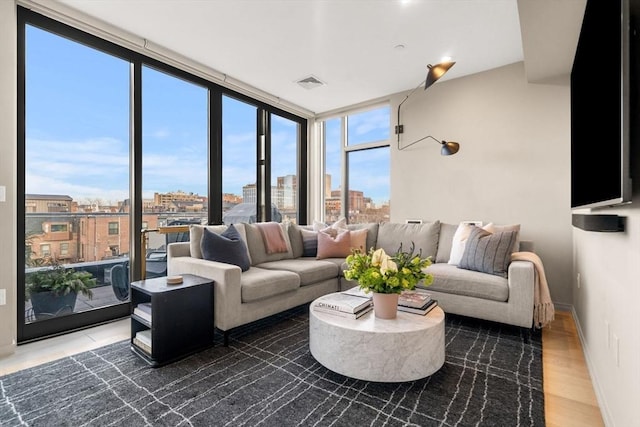 7 E Springfield Unit Ph6, Boston, MA 02118 - living area with wood finished floors and expansive windows