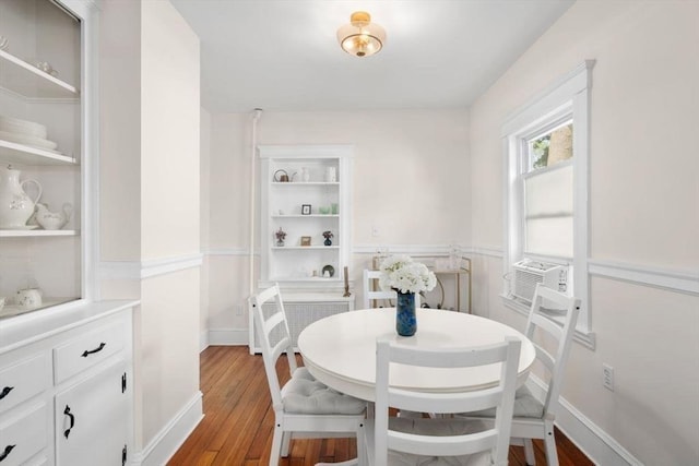127 Highland Ave, Watertown, MA 02472 - dining space with dark wood-style flooring and cooling unit