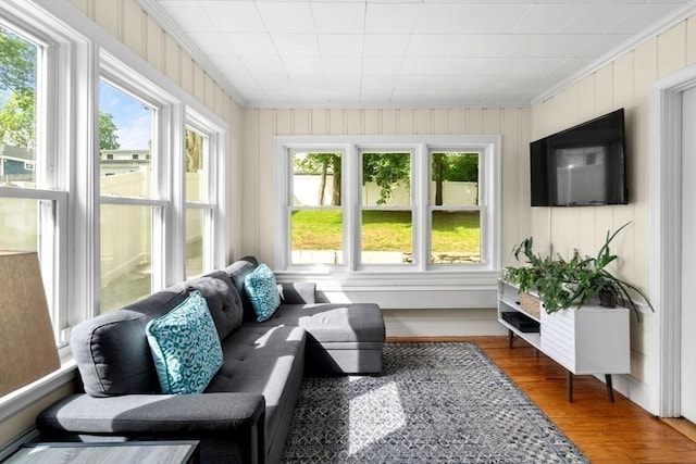 127 Highland Ave, Watertown, MA 02472 - sunroom with healthy amount of natural light, ornamental molding, and wood finished floors