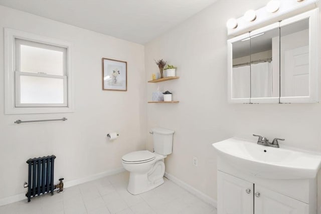 127 Highland Ave, Watertown, MA 02472 - bathroom with radiator heating unit, vanity, toilet, and baseboards