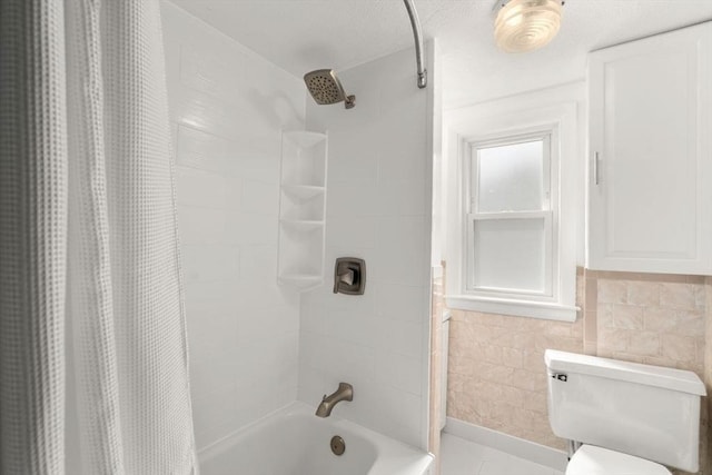 127 Highland Ave, Watertown, MA 02472 - bathroom featuring shower / tub combo and toilet