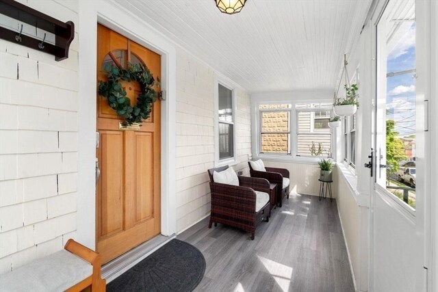 127 Highland Ave, Watertown, MA 02472 - sunroom with wood finished floors