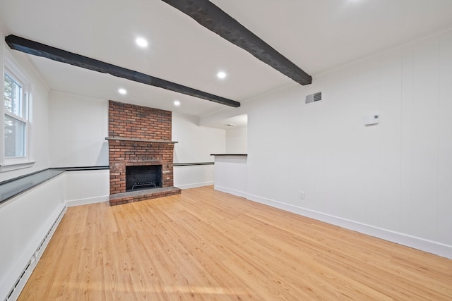 unfurnished living room with beam ceiling, a brick fireplace, light hardwood / wood-style floors, and baseboard heating