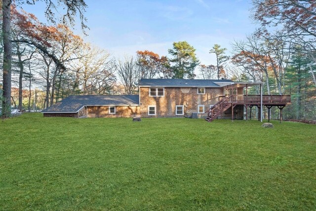 back of house featuring a yard, a deck, and cooling unit