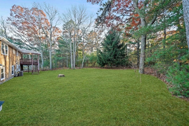 view of yard with a wooden deck