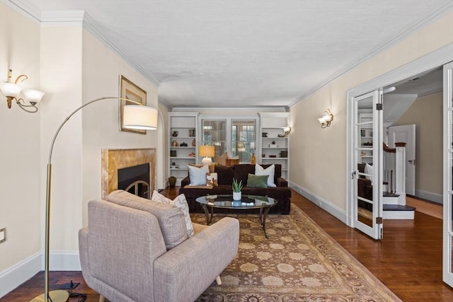 living room featuring dark hardwood / wood-style flooring, ornamental molding, and french doors