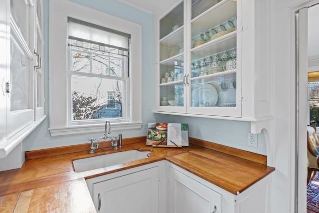 bar with sink and white cabinets