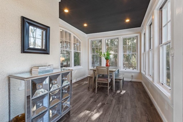 sunroom / solarium featuring wood ceiling