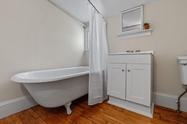 bathroom with shower / tub combo with curtain and hardwood / wood-style floors